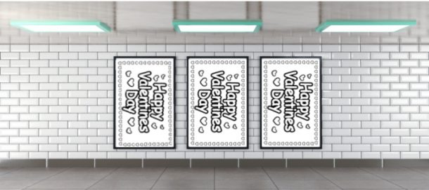 Trois affiches Happy Valentines Day dans une image encadrée noire encadrée contre un mur de briques blanches.