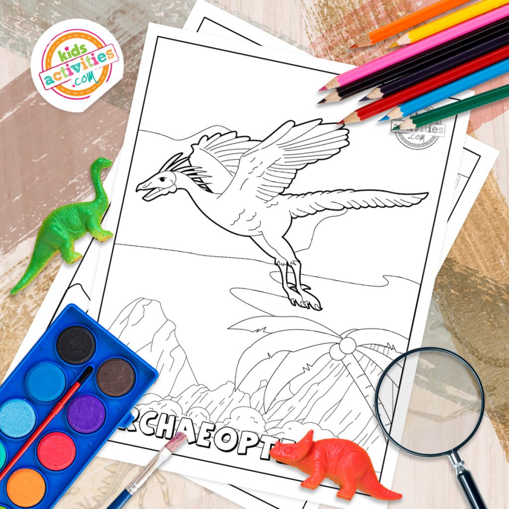 pages à colorier de dinosaures imprimées et posées sur une table avec un fond sur le thème des dinosaures