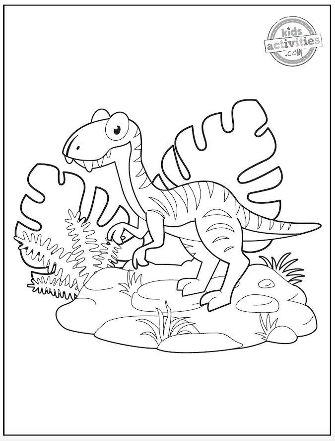 Page de coloriage Velociraptor noir et blanc montrant un vélociraptor de style dessin animé entouré de feuilles tropicales et de rochers