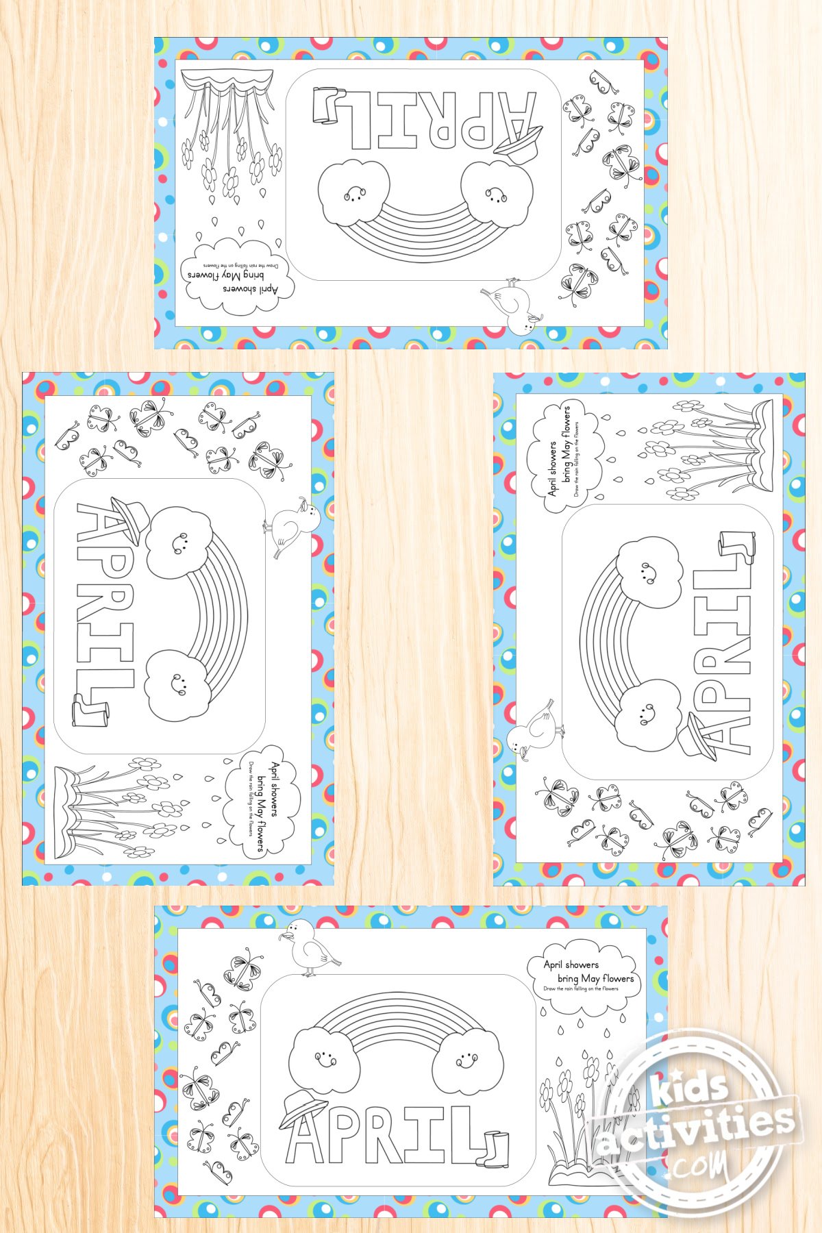 Printable April Placemats Kids Can Color shown from above on a light colored wooden table with four placemats set where placesettings would go