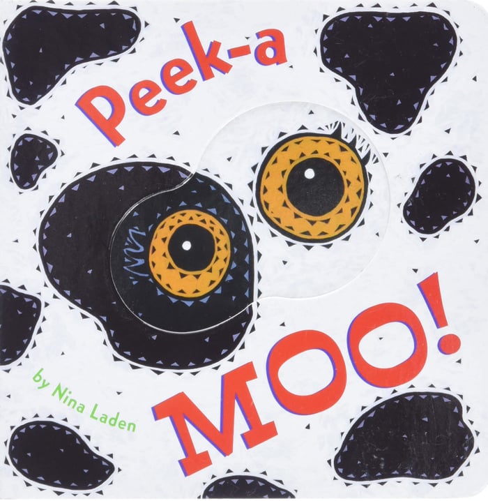 histoire d'animaux pour enfants - L'image montre un livre blanc avec des taches de vache noires et des yeux jaunes d'Amazon.